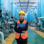 A water engineer inspects membrane filtration equipment at a Singapore water innovation facility