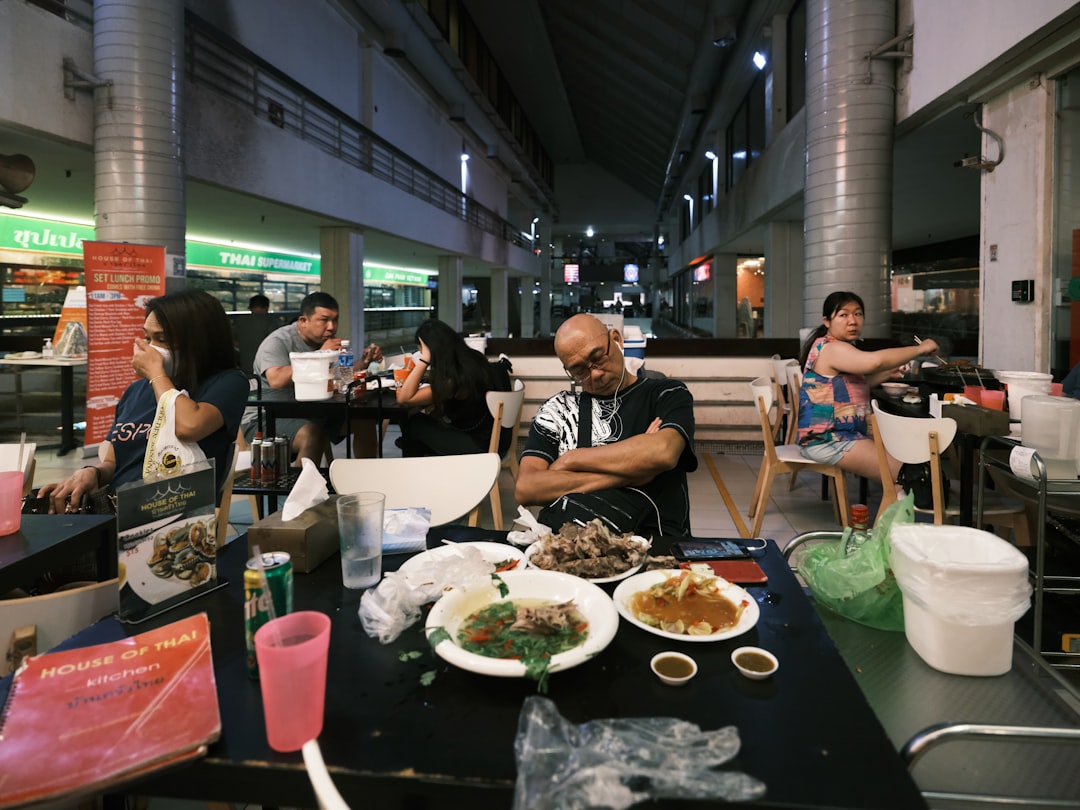 A Singaporean chef carefully plates a dish that blends local flavours with fine dining techniques.