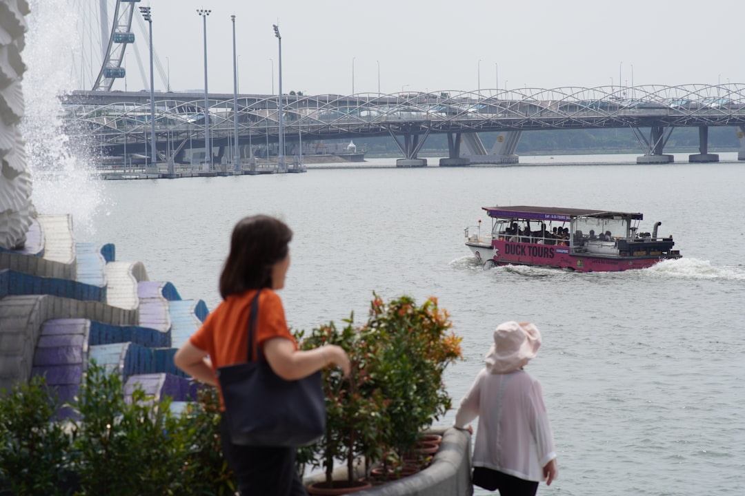 A traveller boards a ferry at Tanah Merah terminal, ready for one of the popular day trips from Singapore to Bintan Island.