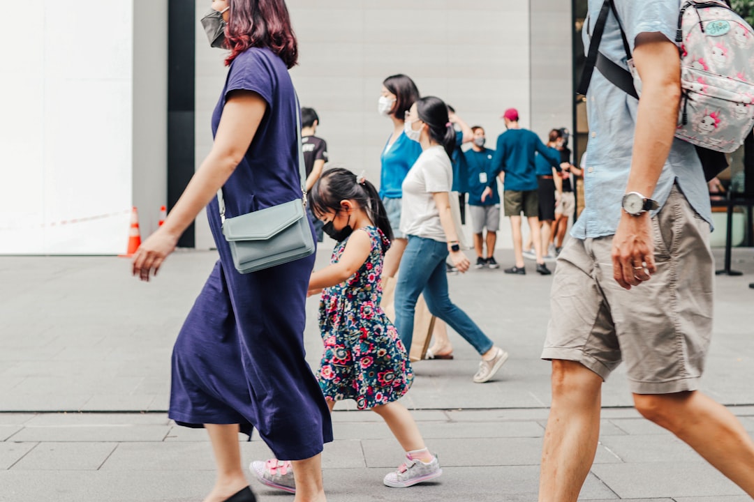 Tourists and shoppers walking along Orchard Road in Singapore as tourist arrivals reach a record high in July 2026