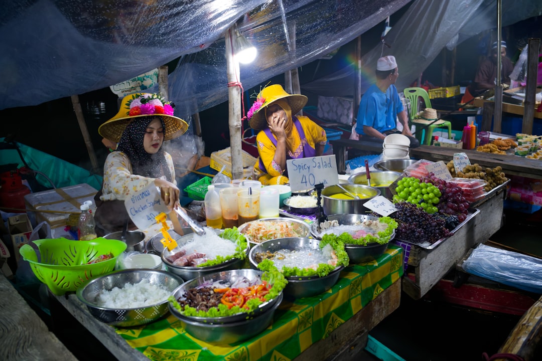 A chef preparing traditional hawker dishes at a Singapore food festival stall, showcasing local culinary heritage