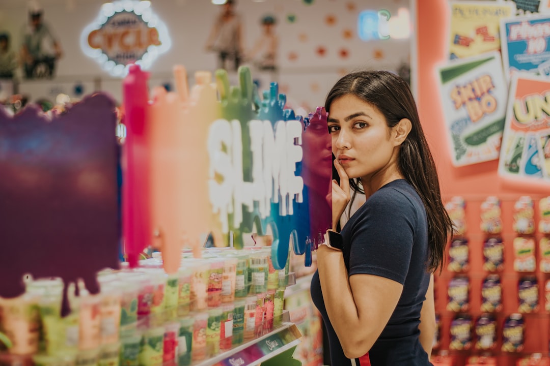 A woman reads a zero waste label on a household product in a Singapore supermarket aisle.