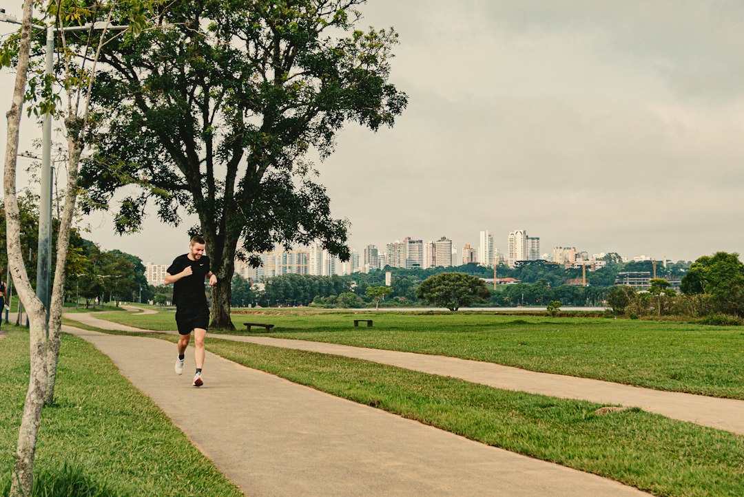 Runner doing marathon training at dawn in Singapore's East Coast Park